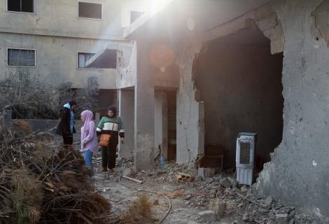 Young women from Lebanon's Baalbek area survey damage to their local neighbourhood caused by attacks by Israeli forces.  